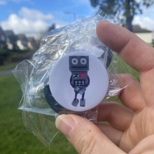 a robot pin badge